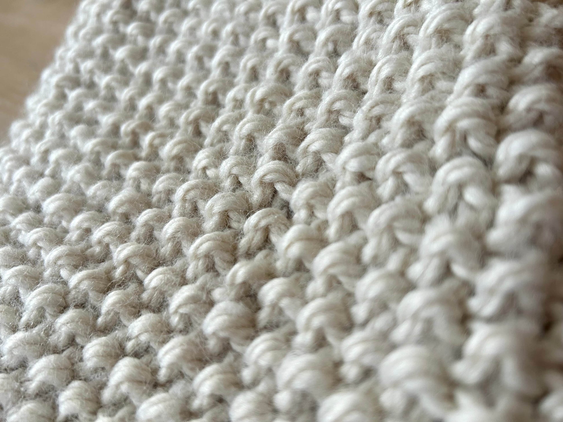 Close-up of a light brown cowl from a cowl and ear-warmer set